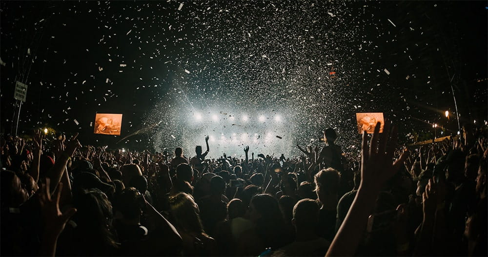 Photographer taking picture of a music festival concert